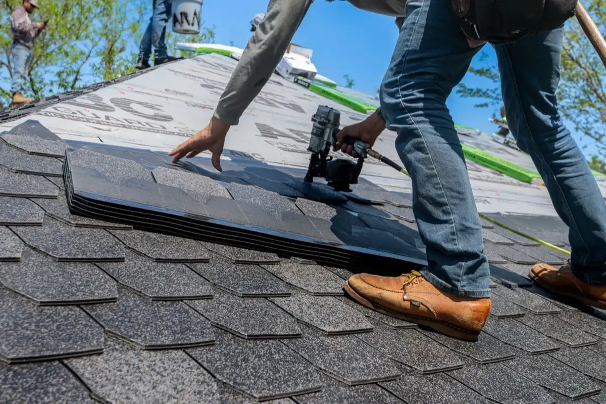 Inspecting an asphalt shingle slope after a hailstorm in Warren, MI